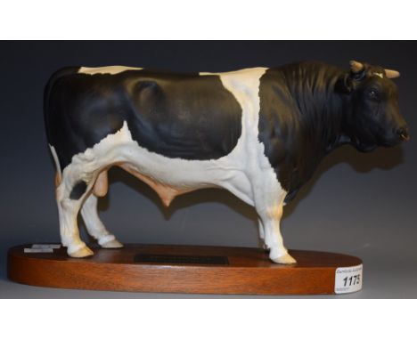 A Beswick Connoisseur model Friesian Bull, wooden plinth 