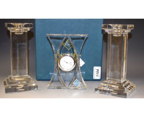 Bohemia Crystal - a pair of contemporary styled candlesticks; a quartz mantel clock, in original boxes 