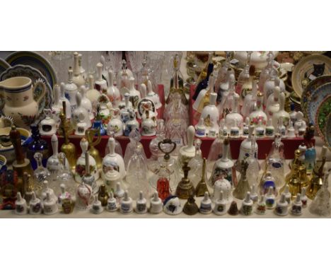 A collection of ceramic, glass and metalware bells including Spode, Wedgwood, Royal Albert, Aynsley, Derwent Crystal, Royal D