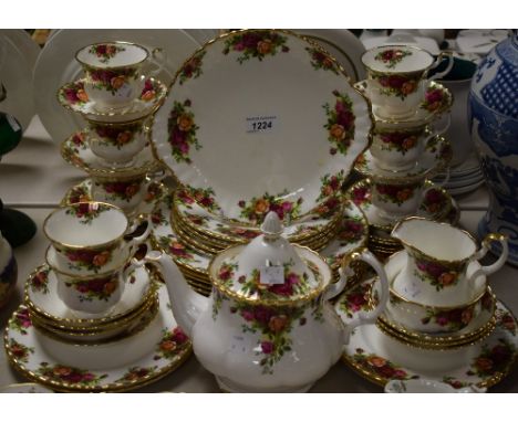 A Royal Albert Old Country Roses part dinner and tea service comprising plates, side plates, cups and saucers, tea pot, cream