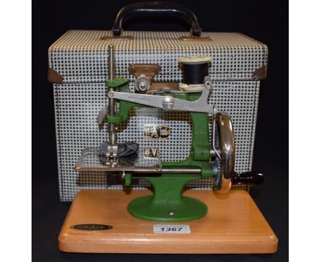 Juvenalia - a child's Grain of Nottingham miniature manual sewing machine, original instructions, needles and key, cased 