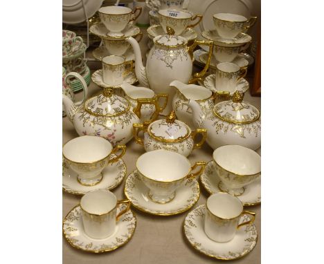 Royal Crown Derby Vines - a coffee set comprising coffee pot, six coffee cans, five Vines saucers, one Royal St. James saucer