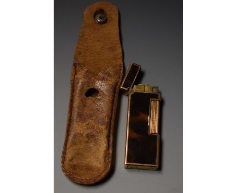 A Dunhill gold coloured metal lacquered pocket lighter, serial No 217915 to folding hinged base, engine turned front and rear