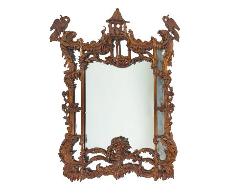 WALL MIRROR, 19th century Chippendale style boxwood with ho ho birds and rocaille carved frame, 119cm H x 75cm.