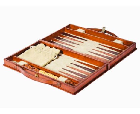 TRAVELLING BACKGAMMON SET, tan leathered case, 23cm W x 40cm D x 7cm H.