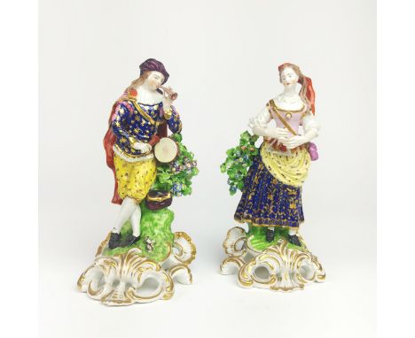 FIGURES, a pair, 19th century Derby, depicting a man blowing his bugle and holding a tambourine, marked to underside, hand pa