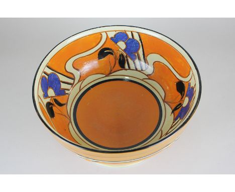 A Clarice Cliff Fantasque lotus pedestal bowl, the hand painted design of blue flowers on orange ground c.1930, base marked W