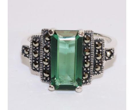 Large silver green stone and marcasite ring in stepped setting stamped 925   Condition Report   Click here for further images