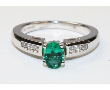 18ct white gold oval emerald and channel set diamond ring hallmarked - emerald approx 1 carat   Condition Report   Click here