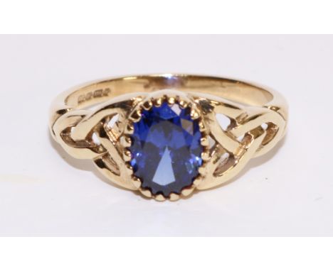 Celtic style 9ct gold ring set with a blue spinel hallmarked   Condition Report   Click here for further images, condition, a