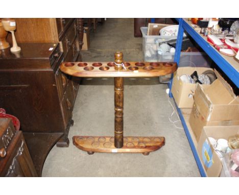 A turned wooden stick stand