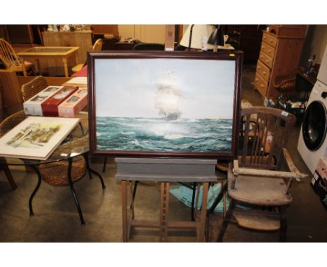 An artists easel and coloured print after Montague Dawson