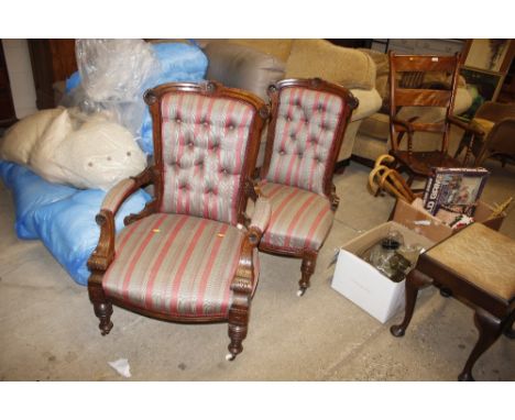 A Victorian walnut armchair and matching nursing chair, upholstered in striped button linen