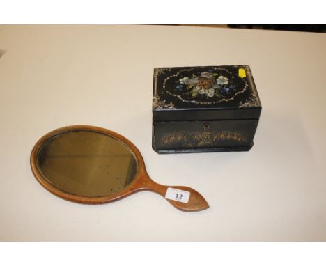 A George III mahogany boxwood and ebony strung hand mirror; and a Victorian papier maché tea caddy with lidded interior  AF