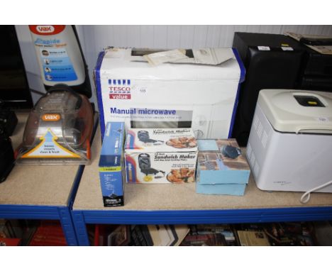 A manual microwave; a sandwich maker; a retractable washing line and a wireless booster 
