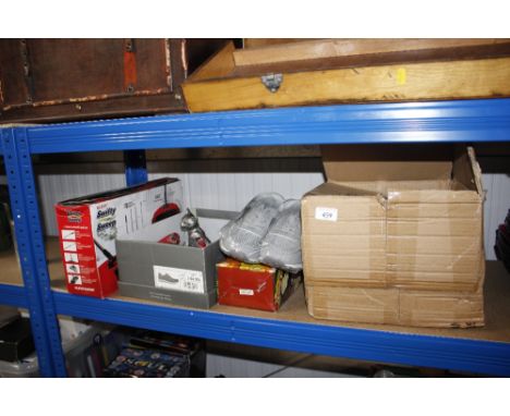 A quantity of children's trainers; various cat ornaments; a Super Slicer and a Swifty Sweep