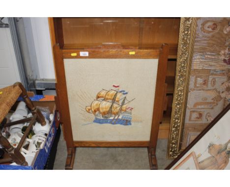 An oak needlework firescreen 