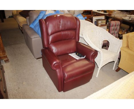 An electric reclining tilting armchair in ruby leather, supplied by The Mobility Furniture Co. Copy of original receipt avail