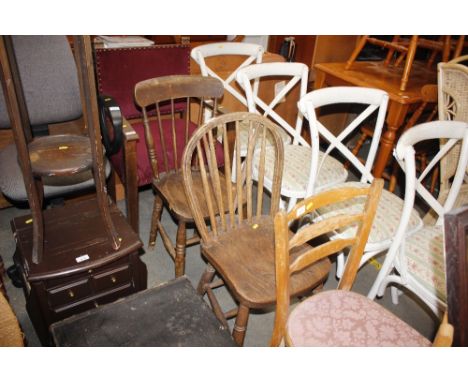 An elm seated stick and hoop back kitchen chair; and another elm seated stick back chair 