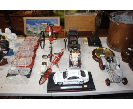 Four model cars and two model bikes 