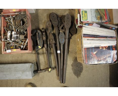 A quantity of pipe cutters and benders