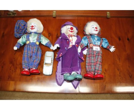 Three clown ornaments; and a model Corgi Jaguar XJS
