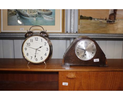 An oak cased chiming mantel clock by Bonner &amp; Son Colchester; and a large quartz alarm clock