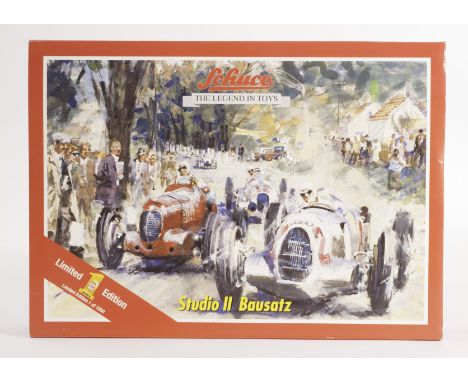 A Schuco Modern Limited Edition Studio II Bausatz, tinplate clockwork set with an Auto Union racing car, wheels, tyres and to