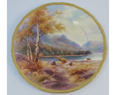 A Royal Worcester cabinet plate, decorated with a view of a lake by H Davis, titled to the back, dated 1940, diameter 10.5ins