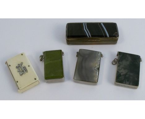 A moss agate metal mounted vesta case, together with two similar hardstone metal mounted vesta cases, an ivory vesta case, an