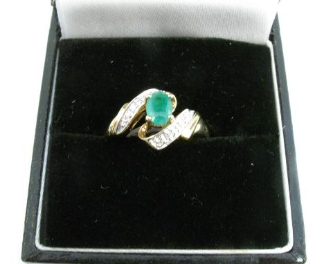 A 9 carat gold emerald and diamond ring, finger size N 1/2, 2.3g gross