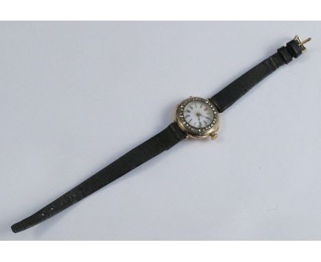 Anonymous, a lady's wrist watch, stamped '18c' and '755', enamel dial, rose diamond set bezel, unsigned movement, on a strap