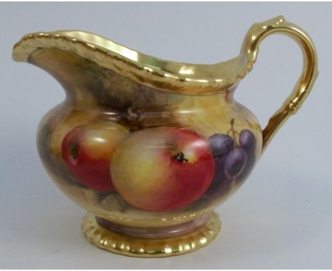 A Royal Worcester milk jug, decorated all around with fruit to a mossy background by J Smith, with a shaped gilt edge, height