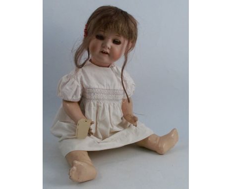 A Heubach Kopplesdorf bisque headed doll, stamped 320 61/2, height 24ins