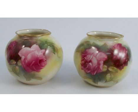 A pair of Royal Worcester vases, the moulded body decorated with pink and red roses, shape number G161, dated 1922, height 2.