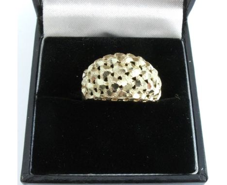 A 9 carat gold dress ring, with pierced and diamond cut decoration, finger size N, 3.1g gross