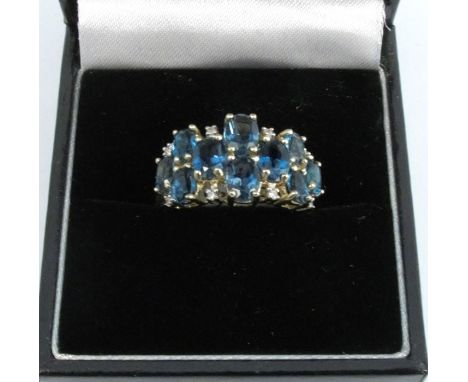 A 9 carat white gold blue topaz and diamond ring, finger size N, 3.6g gross
