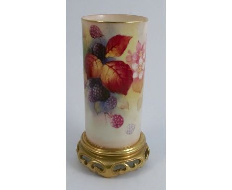 A Royal Worcester cylindrical vase, decorated with Autumnal fruits and leaves by K Blake, raised on a gilt pierced foot, shap