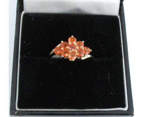 A 9 carat gold nine stone fire opal cluster ring, finger size N, 2g gross