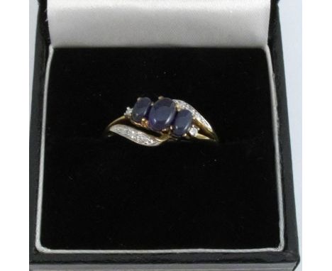 A 9 carat gold three stone opal ring, with diamond set shoulders, finger size N, 3.1g gross