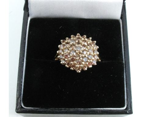 A 9 carat gold brown diamond cluster ring, the thirty nine brilliant cuts totalling approximately 1.3 carats, finger size N, 