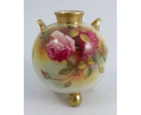 A Royal Worcester globular vase, decorated with pink and red roses by M Hunt, having a pair of gilt handles and raised on thr