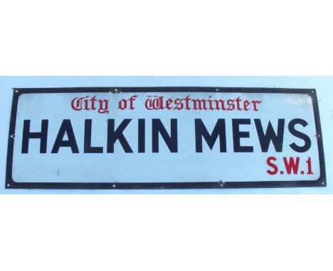 A City of Westminster enamel sign, Halkin Mews S.W.1,12ins x 36ins