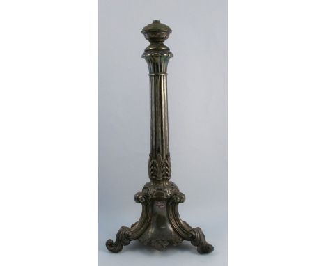 A silver plated lamp base, formally an oil lamp base, with fluted column, leaf moulding, the base formed as scrolling leaves,
