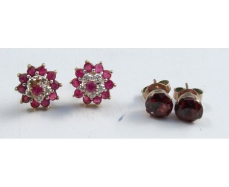 A pair of ruby and diamond cluster ear studs, stamped '9ct', 2g gross, together with a pair of garnet ear studs