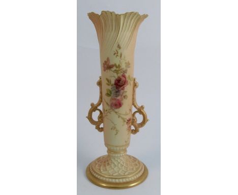 A Royal Worcester blush ivory vase, with moulded decoration to the top, floral sprays, a pair of scroll handles and raised on