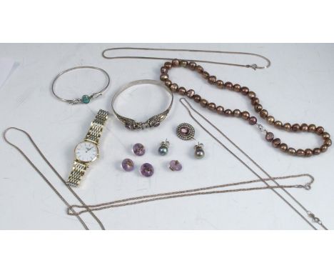 An opal triplet set silver bangle, together with an amethyst set silver bangle, a brooch, four silver chains, a pair of ear s