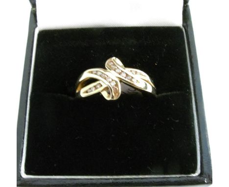 A 9 carat gold ring channel set with cinnamon diamonds, finger size M 1.2, 3.2g gross