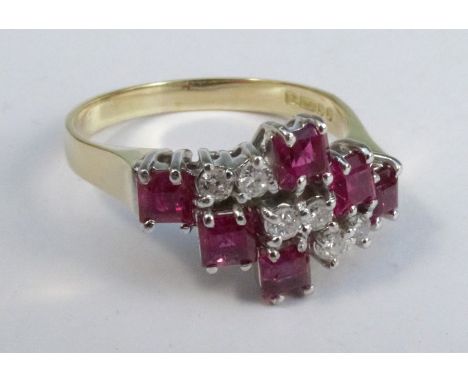 A ruby and diamond 18 carat gold ring, with three square cut rubies either side of three pairs of diamonds, finger size Q, 4.