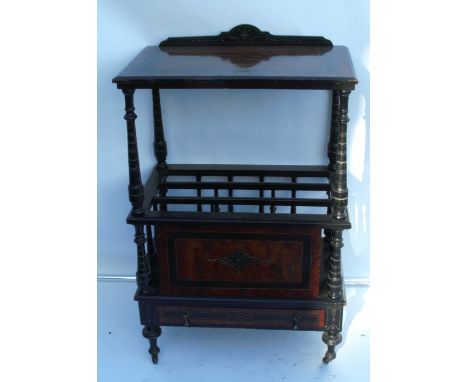 A late 19th century burr wood and ebonised Canterbury whatnot, with a shelf raised on turned supports, over a Canterbury and 